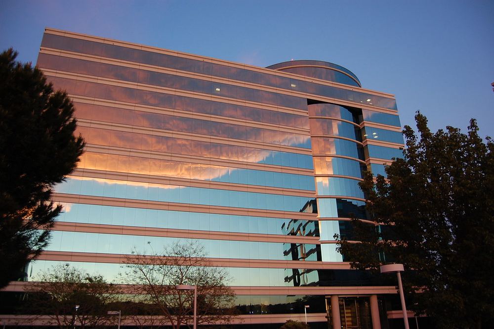 Modern glass office building representing digital transformation